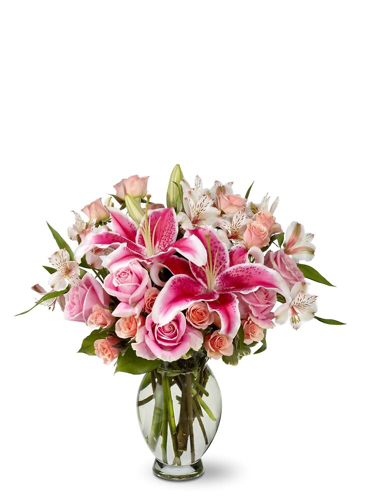 Pink lilies with mixed flowers arranged by a florist in Wantagh, NY USA